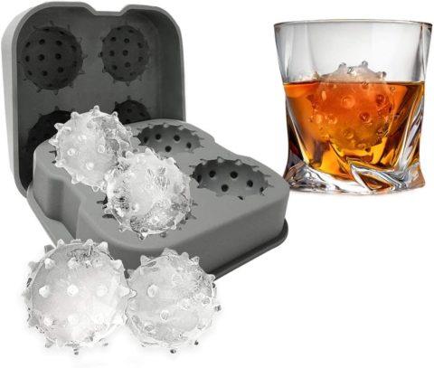 civid ice mold with ice next to glass of whisky