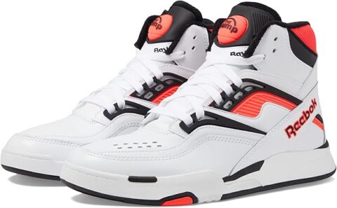 White Reebok Pump Retro Sneakers with black and red accents, featuring the iconic pump button on the tongue and a high-top basketball silhouette.