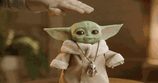 Animated Baby Yoda toy from The Mandalorian moving and reacting